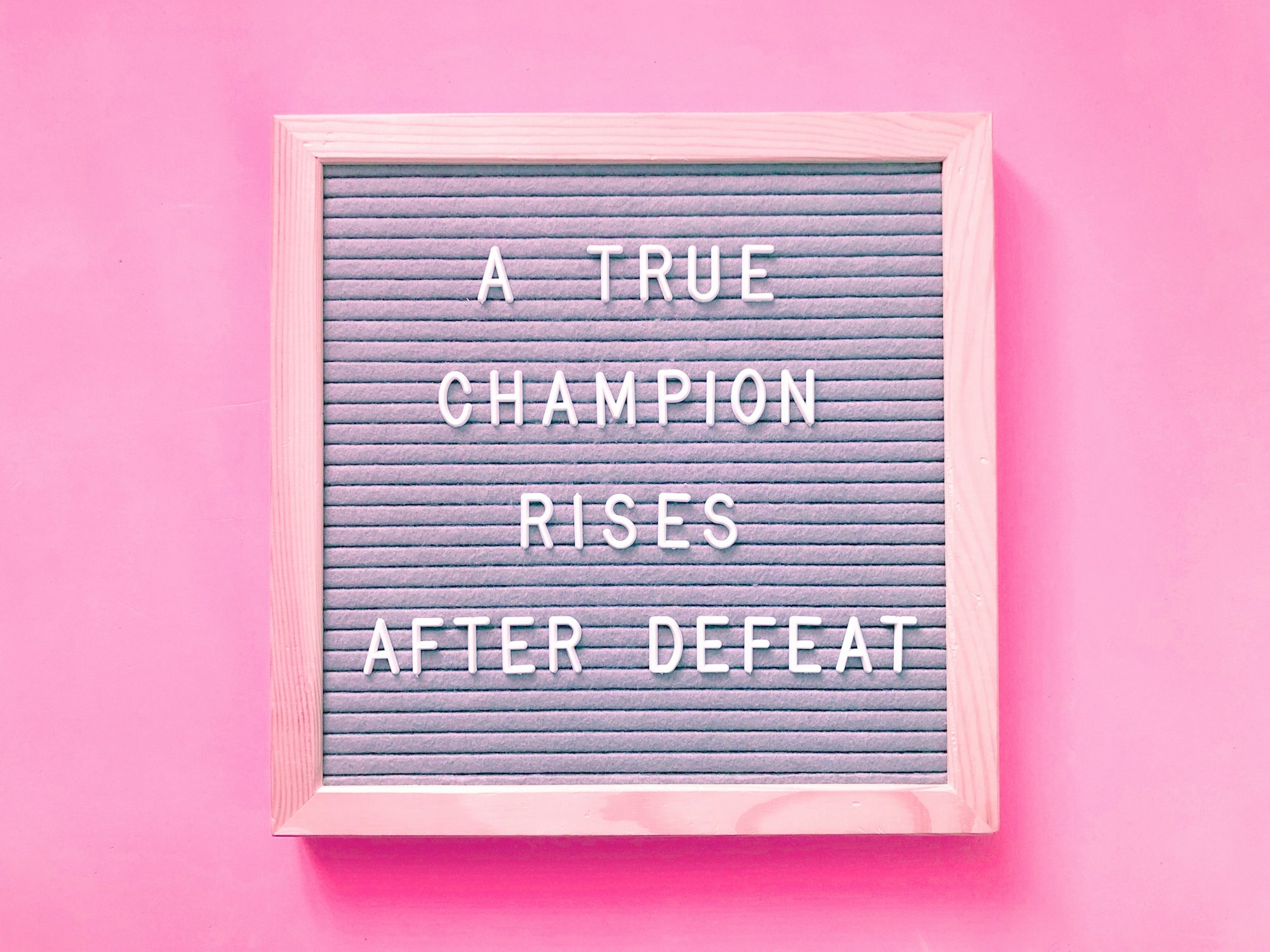 A true champion rises after defeat. Quote.